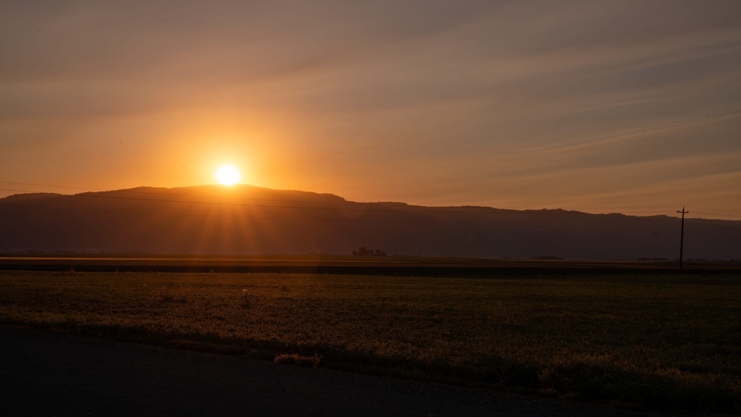 Dramatic sunset light breaking through clouds