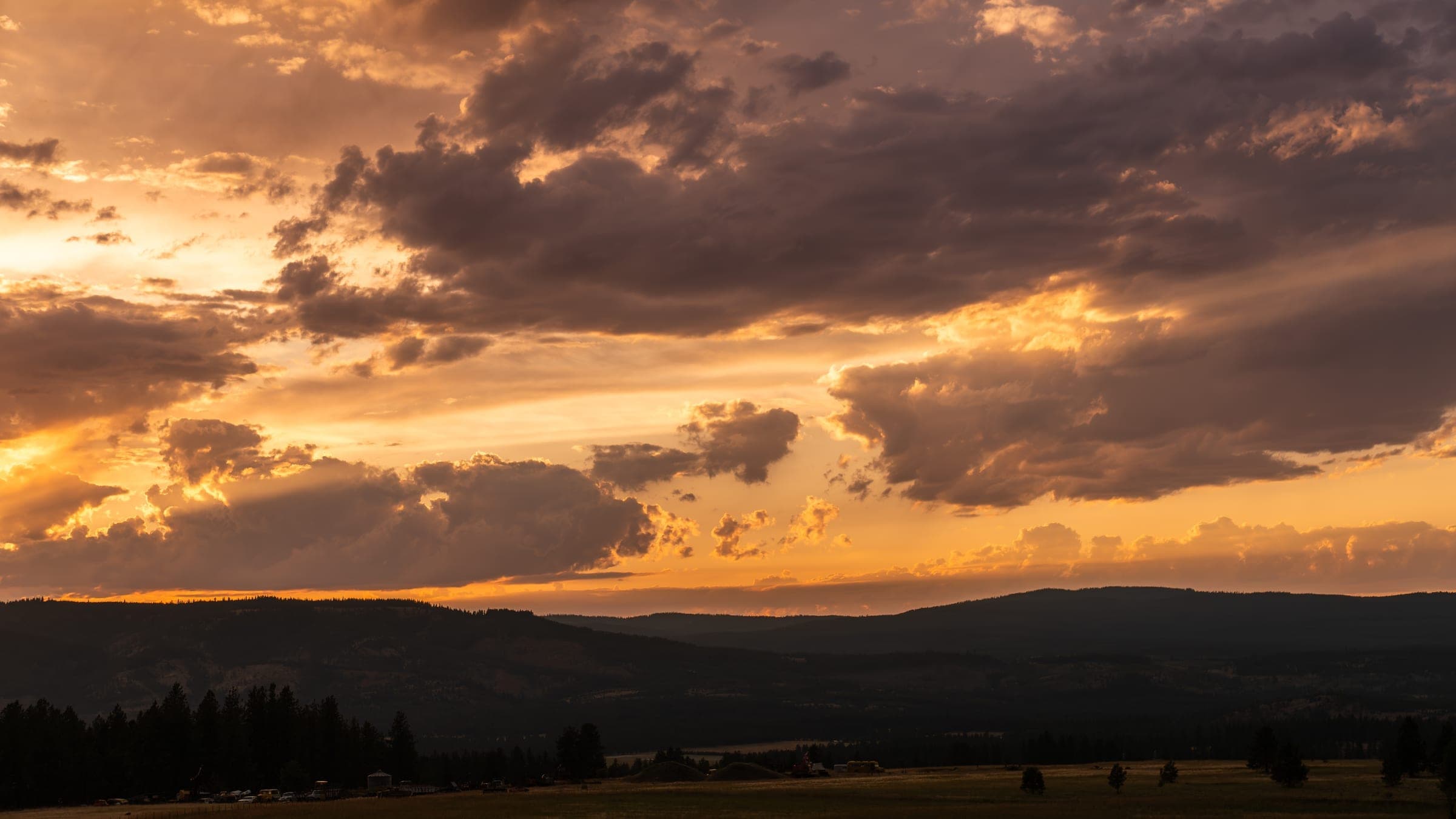 Pink and gold clouds over the quiet valley road