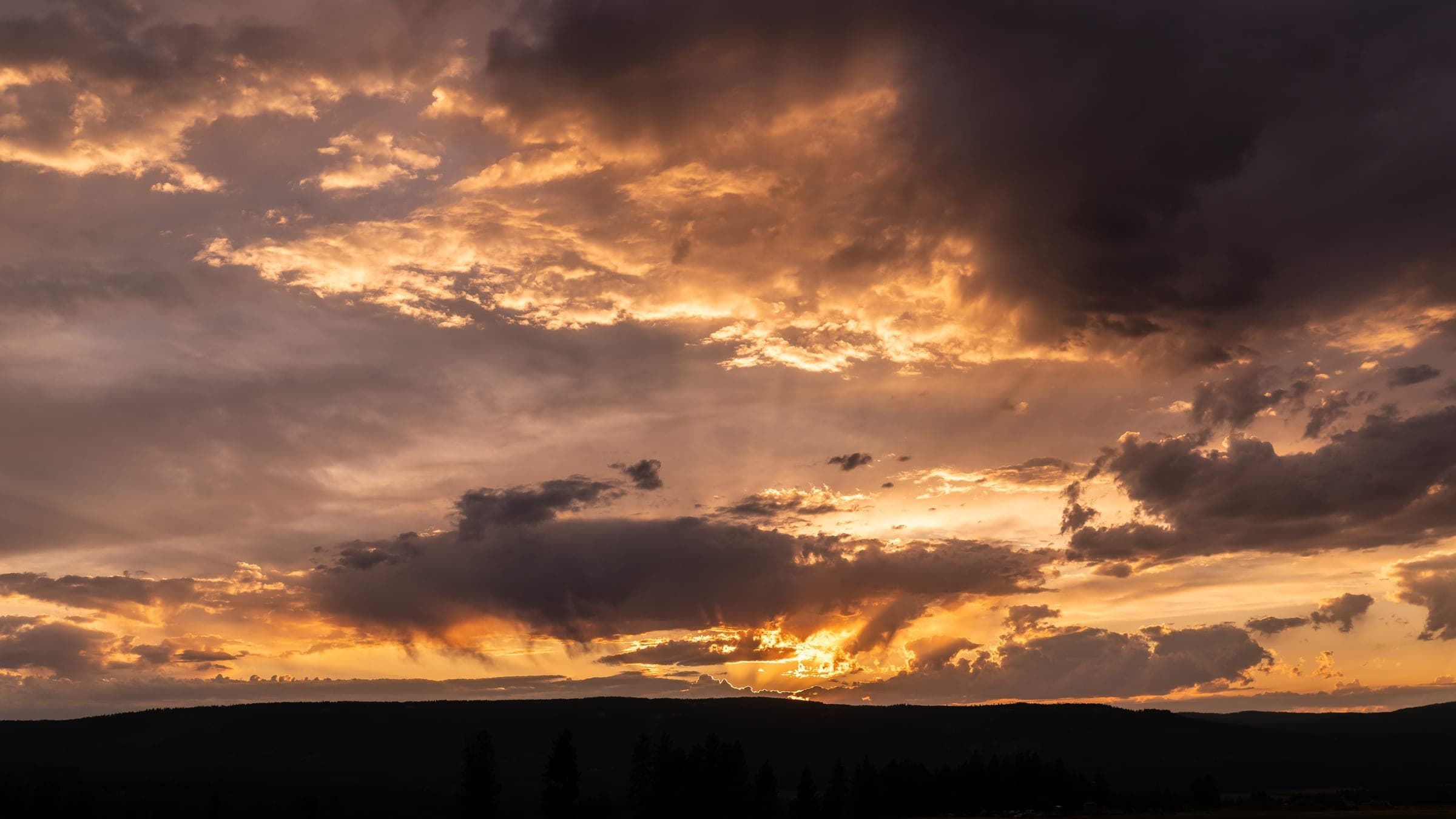 Cloud formations lit up by the setting sun