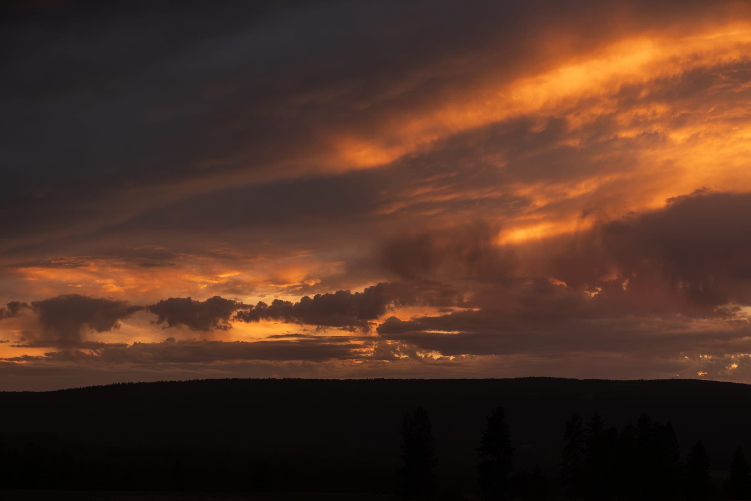 Purple and orange sky over the country road