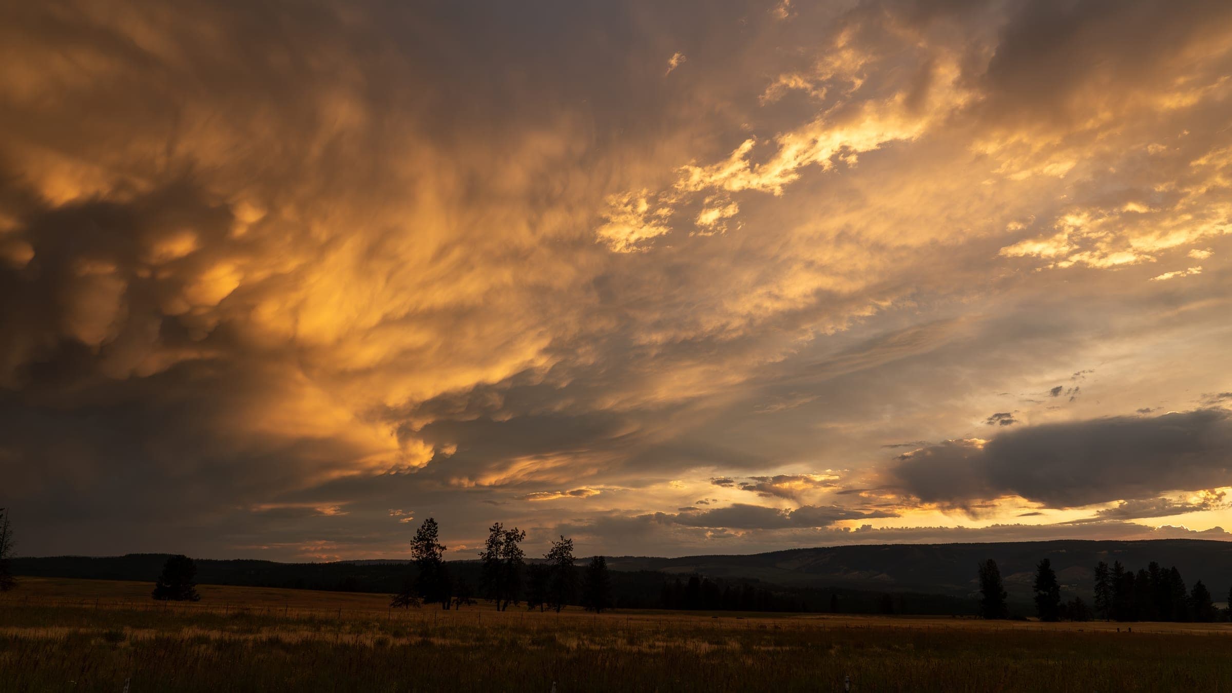 Fiery clouds reflected in the evening sky