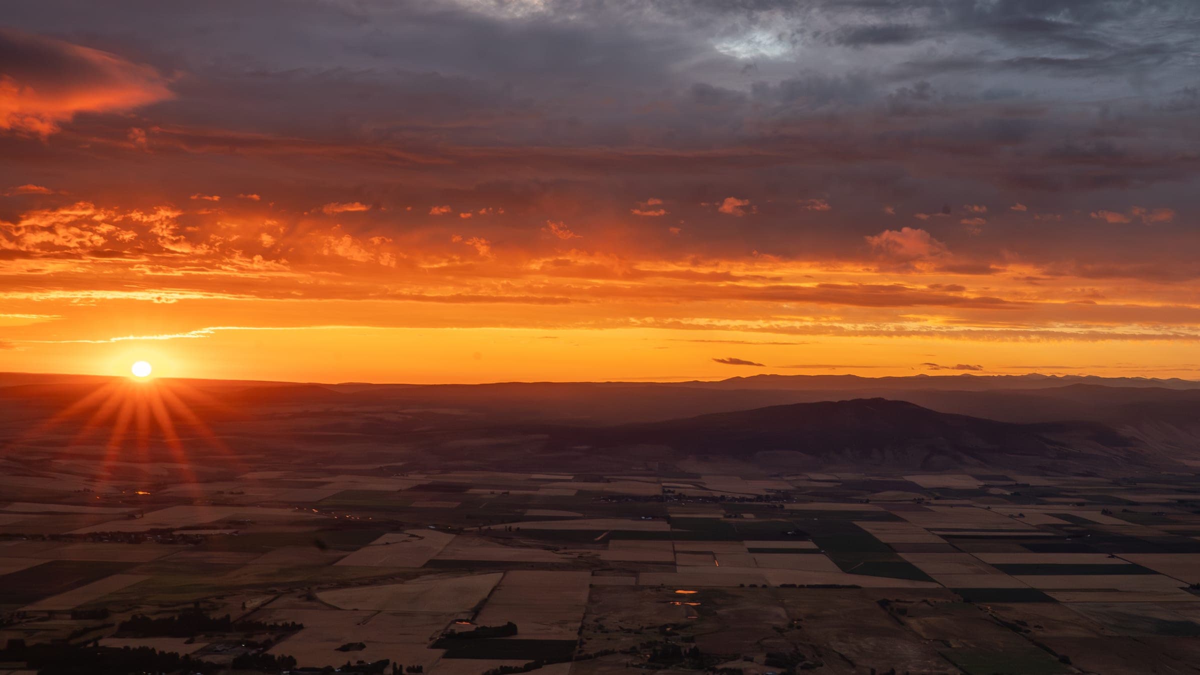 Golden sunburst illuminating the valley from Indian Rock
