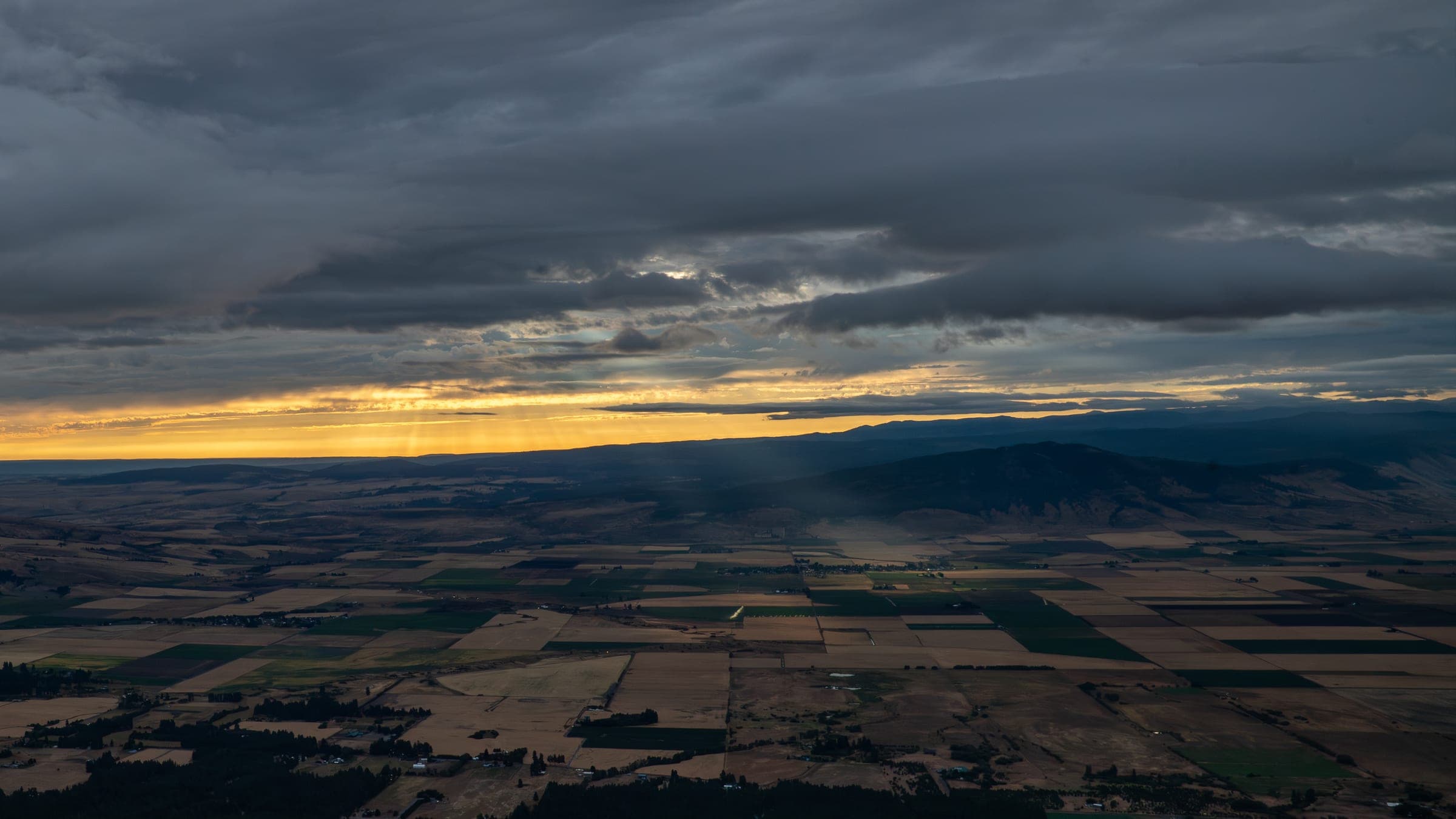 Late afternoon sunburst casting long rays from Indian Rock